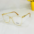 Gold-framed glasses with 'Dior' logo